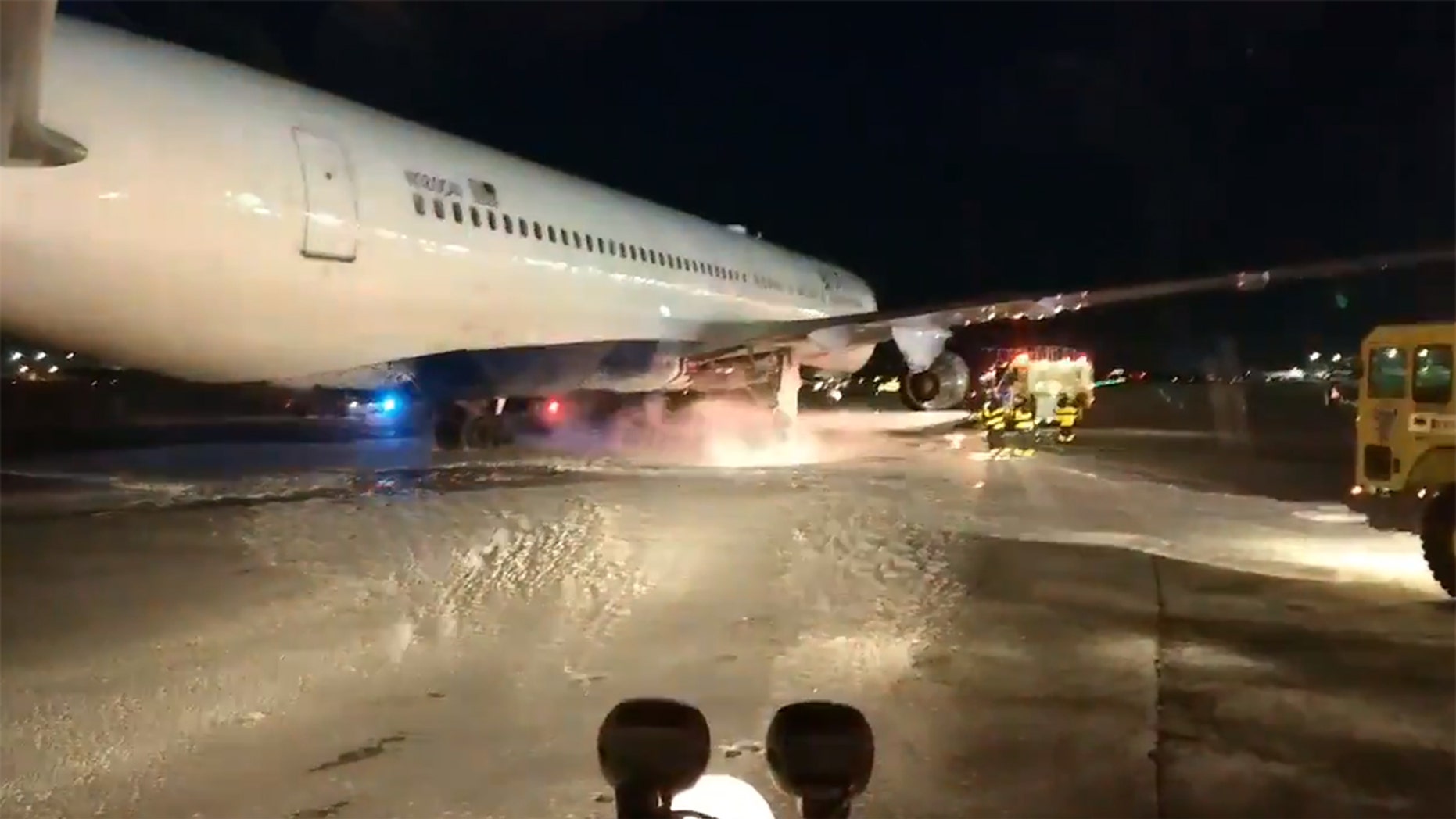The flames were extinguished on the taxiway, Port Authority officials confirmed.