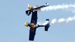 Planes clip wings in nearly disastrous air show stunt