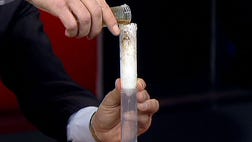 Glenn Rink demonstrates how a Smart Sponge absorbs pollutants from water and how it can help clean up oil spills