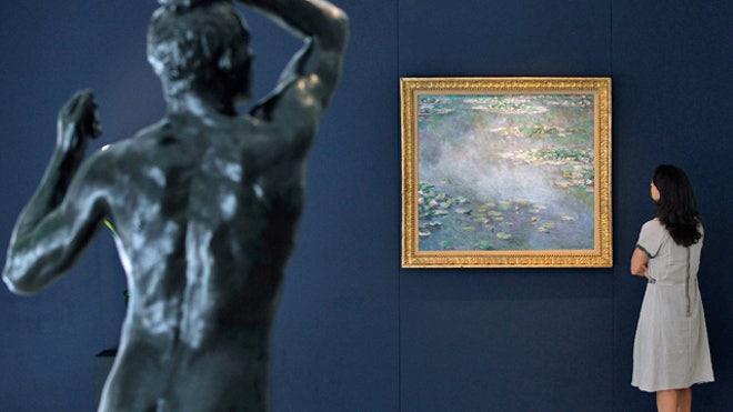 Woman Viewing Artwork at Museum