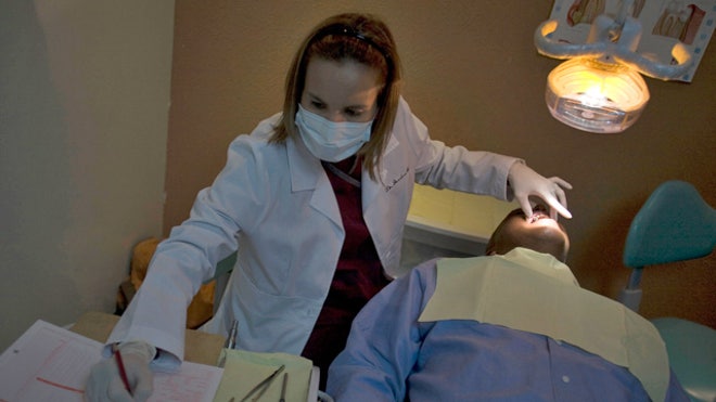 Dentist Working on a Patient