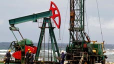 U.S. crude oil prices slid % on data showing the eurozone's economy is continuing to contract, potentially crimping demand from a major importer.