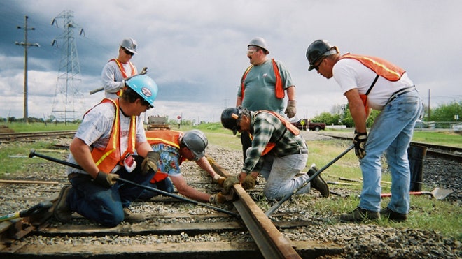 Government-Contractors-Working-Train-Rail-Stimulus