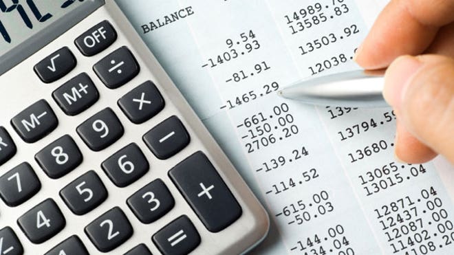 Calculator Lying on a Balance Sheet