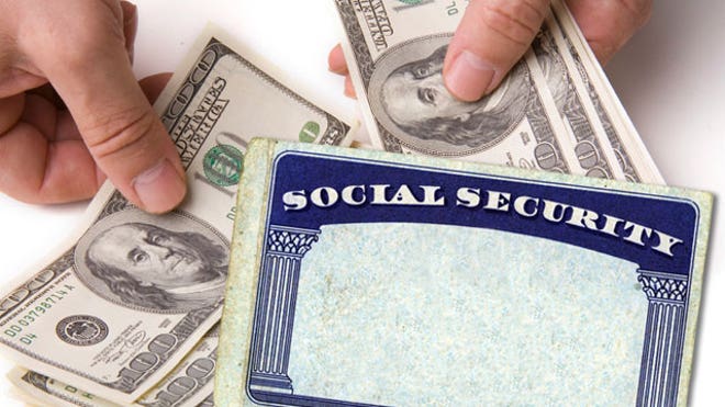 Social Security Card With Cash in Hands