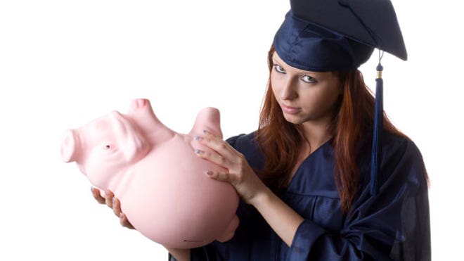 Graduate-Holding-Empty-Piggy-Bank