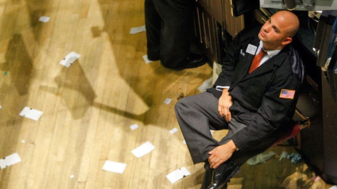 NYSE-Trader-051-Sits-After-Long-Day