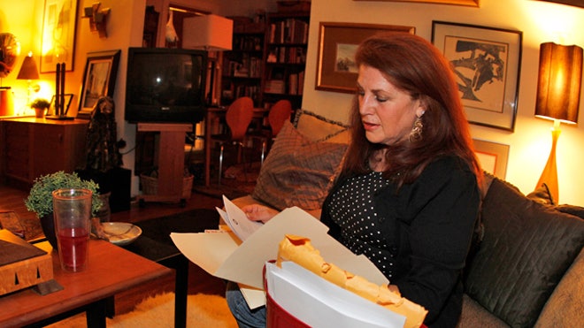 Woman-Looking-Files--Paperwork-Insurance