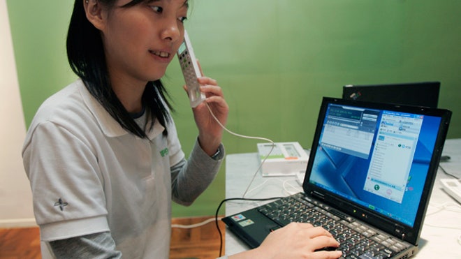 Woman-Uses-Skyple-Internet-Phone-VoIP