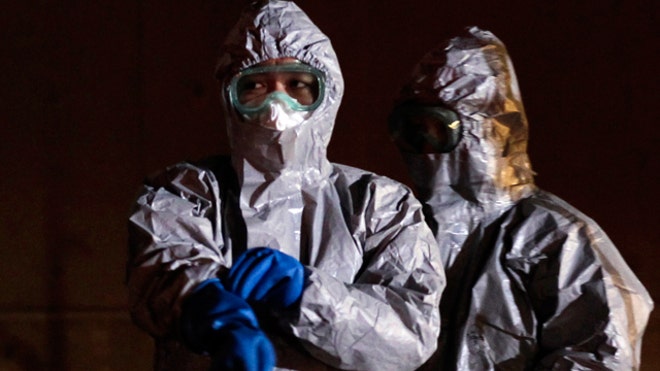 japan-officials-in-protective-gear
