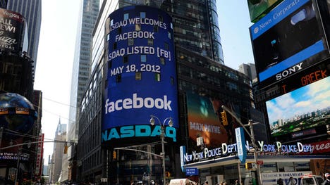 Facebook's shares met with mixed reviews in their long-awaited debut, closing for the day up just  cents or less than %. Analysts cited the massive scale of the deal for the lack of 'pop.' Volume broke records.