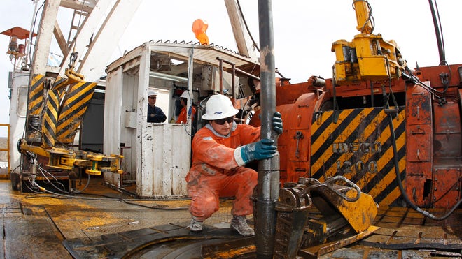 Oil Worker Operates Drill 2