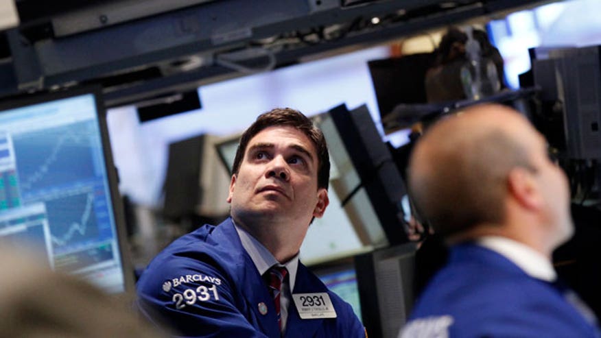 NYSE Trader Looking at Monitors