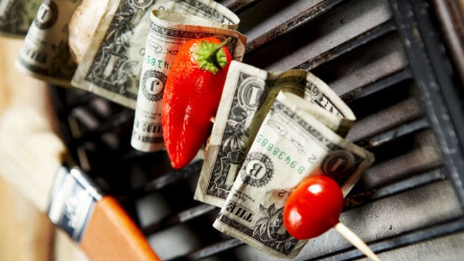 Cash Cooking on a Barbecue