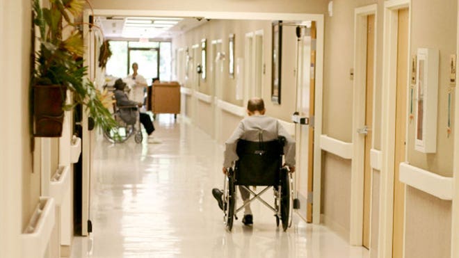 Elderly Man in a Wheelchair at a Nursing Home