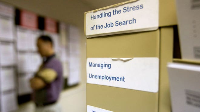 Job Seeker Reads Job Postings Board
