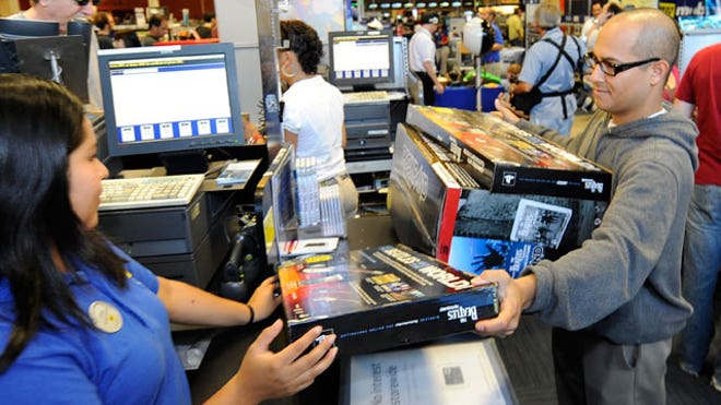 Customer Purchases Game at Best Buy Store