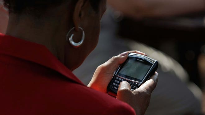woman on phone texting