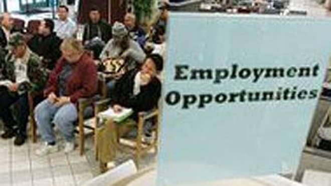 Jan. 23: People wait to talk to unemployment benefits staff at an Employment Development Department office in San Jose, Calif. (AP Photo)