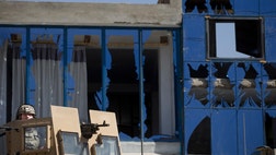 A suicide car bombing tore through a U.S. convoy during rush hour in the Afghan capital on Thursday, killing at least  people, including six U.S. military advisers and two children, officials said. U.S. soldiers rushed to the scene to help, including some wearing only T-shirts or shorts under their body armor.