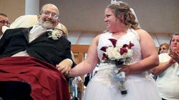 >A volunteer team of medical professionals helped Nagy escort the 24-year-old bride as groom Angelo Salvatore and the Rev. Chuck Knerem awaited their arrival.