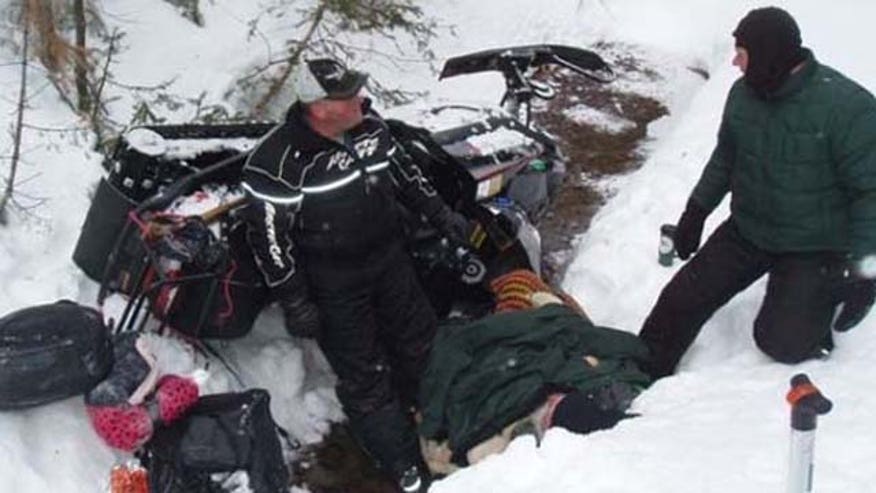 ManTrappedSnowmobile.jpg