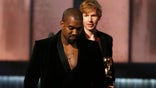 Kanye West storms Grammy stage over Beck's surprise album of the year win