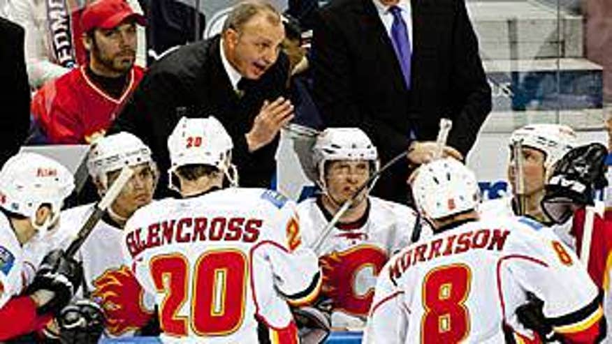 sutter_flames_coach_behind_bench_325x183