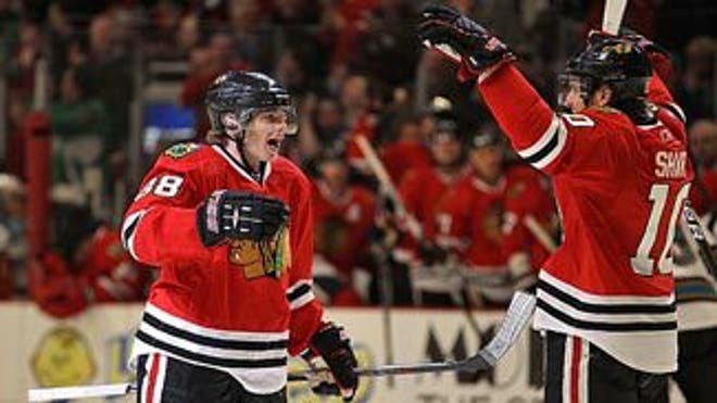 kane_sharp_celebrate_031411_325x183