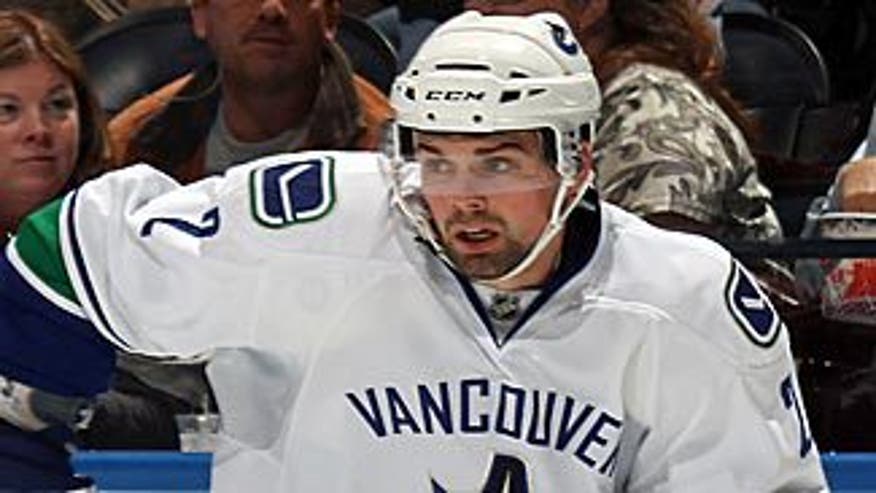hamhuis_canucks_action