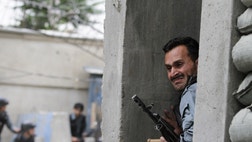 A Taliban suicide car bomber and five heavily armed gunmen attacked an international aid group's guest house in the Afghan capital on Friday, killing two guards and setting off an hours-long battle with security forces in an upscale Kabul neighborhood, authorities said.