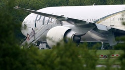 Britain scrambled fighter jets Friday to intercept a commercial airliner carrying more than  people from Pakistan, diverting it to an isolated runway at an airport on the outskirts of London and arresting two British passengers who allegedly threatened to destroy the plane.