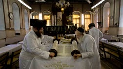 >Israelis ushered in the holiest day of the Jewish calendar at sundown Friday as the entire country ground almost to a halt for Yom Kippur, Judaism's day of atonement, observed with a 25-hour fast and long prayers.