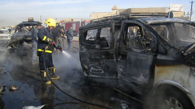 Iraq bombing burned car