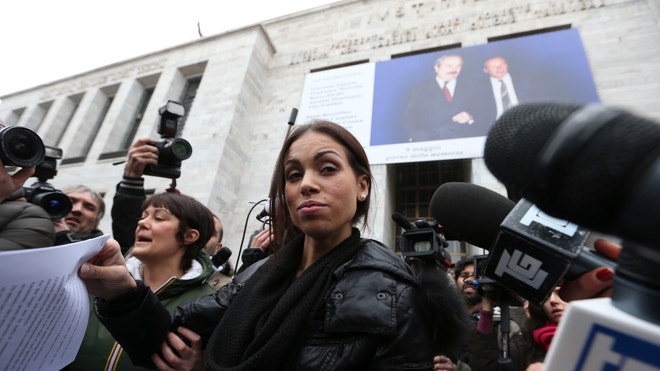 Italy%20Berlusconi%20Trial-%20girl%20june24.JPG