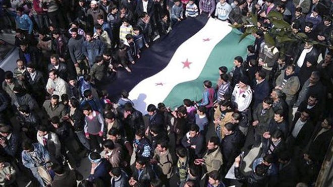 Syria anti regime protesters holding flag