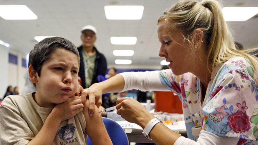 Pediatrician Giving Child Vaccination