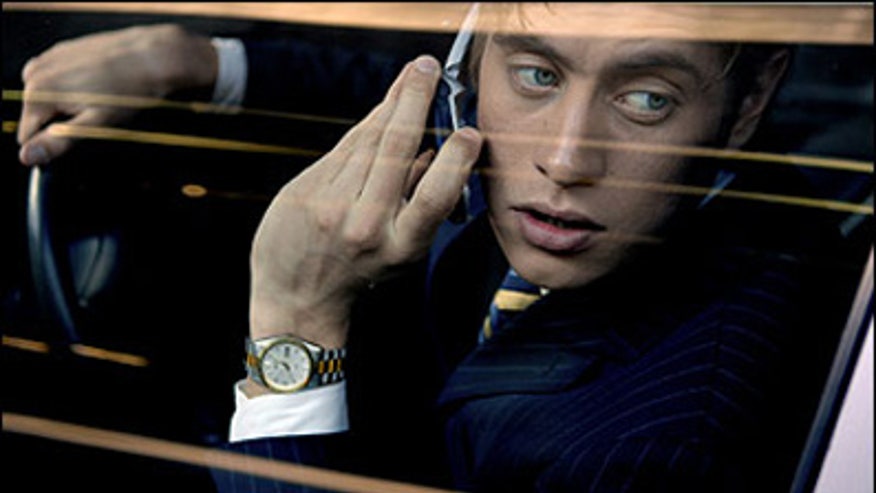 Man Driving With Cell Phone