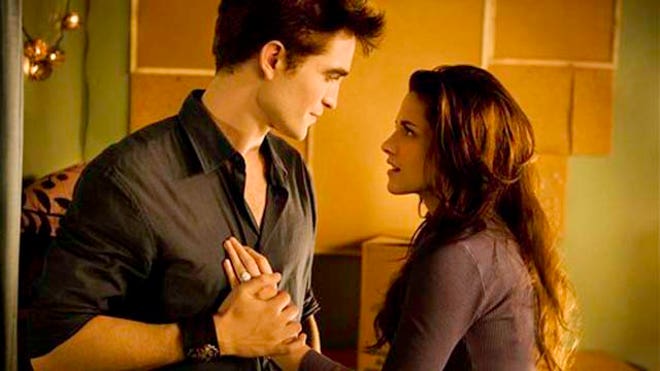 In this image released by Summit Entertainment, Kristen Stewart, right, and Robert Pattinson are shown in a scene from "The Twilight Saga: Breaking Dawn Part 1."AP/2011 Summit Entertainment, LLC.
			