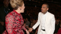 >Adele took to Twitter to clear up rumors she was yelling at Chris Brown during the Grammys. 