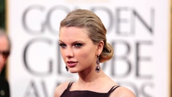 >Taylor Swift didn't look pleased when Adele took home the award for best original song. 
