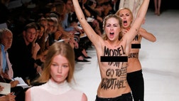 A British supermodel punched a topless female protester after she was grabbed on the catwalk during Paris Fashion Week, but didn’t let the scuffle stop her, saying that she “carried on walking with a bit of sassiness.”