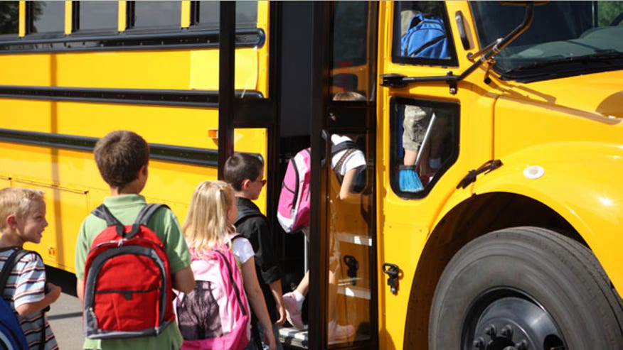 Elementary School Students Get on Bus