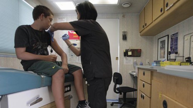 Teens getting vaccine AP