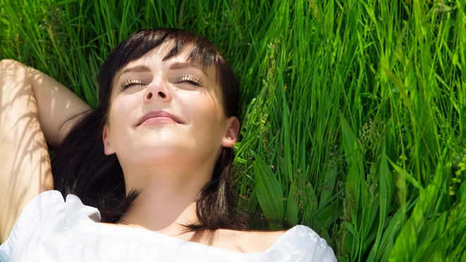 happy woman in grass formatted istock.jpg