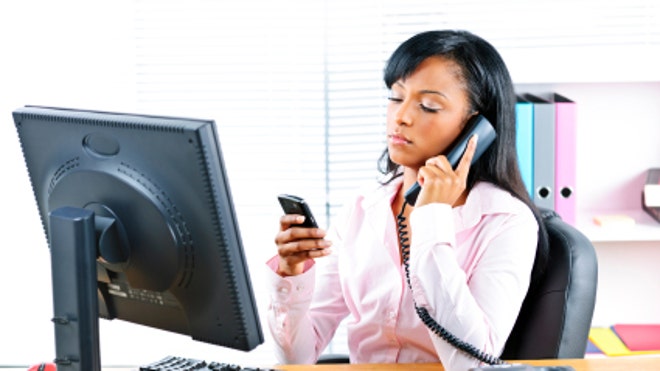 woman multitasking in the office