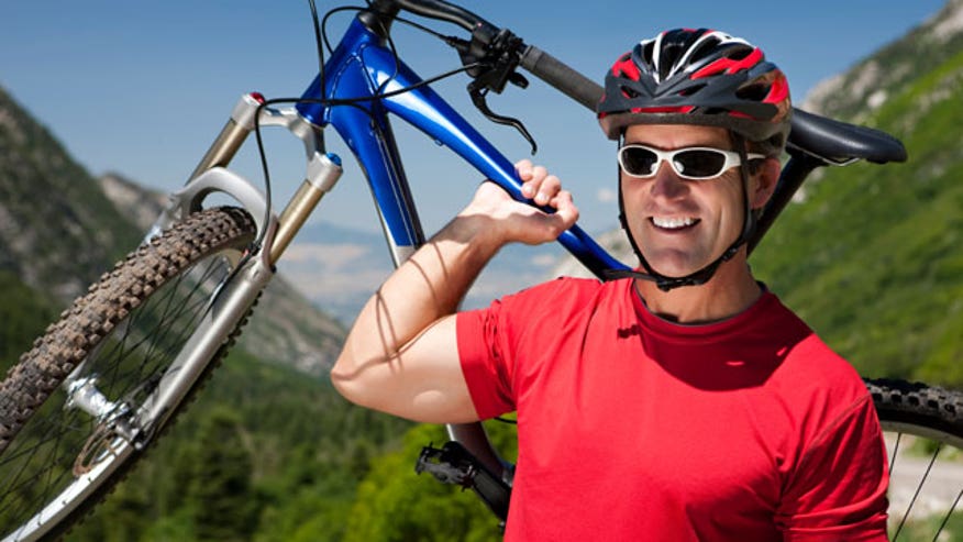 Man mountain biking iStock