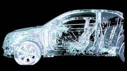 >Crashed car hoisted onto a turntable.