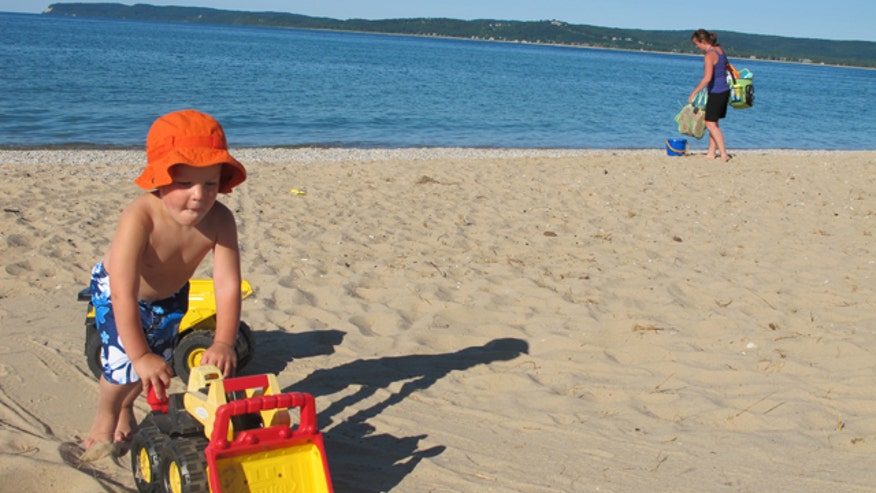 Boy Playing on Beach