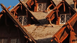 >A Massachusetts woman says she and fellow tour-group members were locked under armed guard inside a Yellowstone National Park hotel during a visit to the park at the start of the government slimdown.